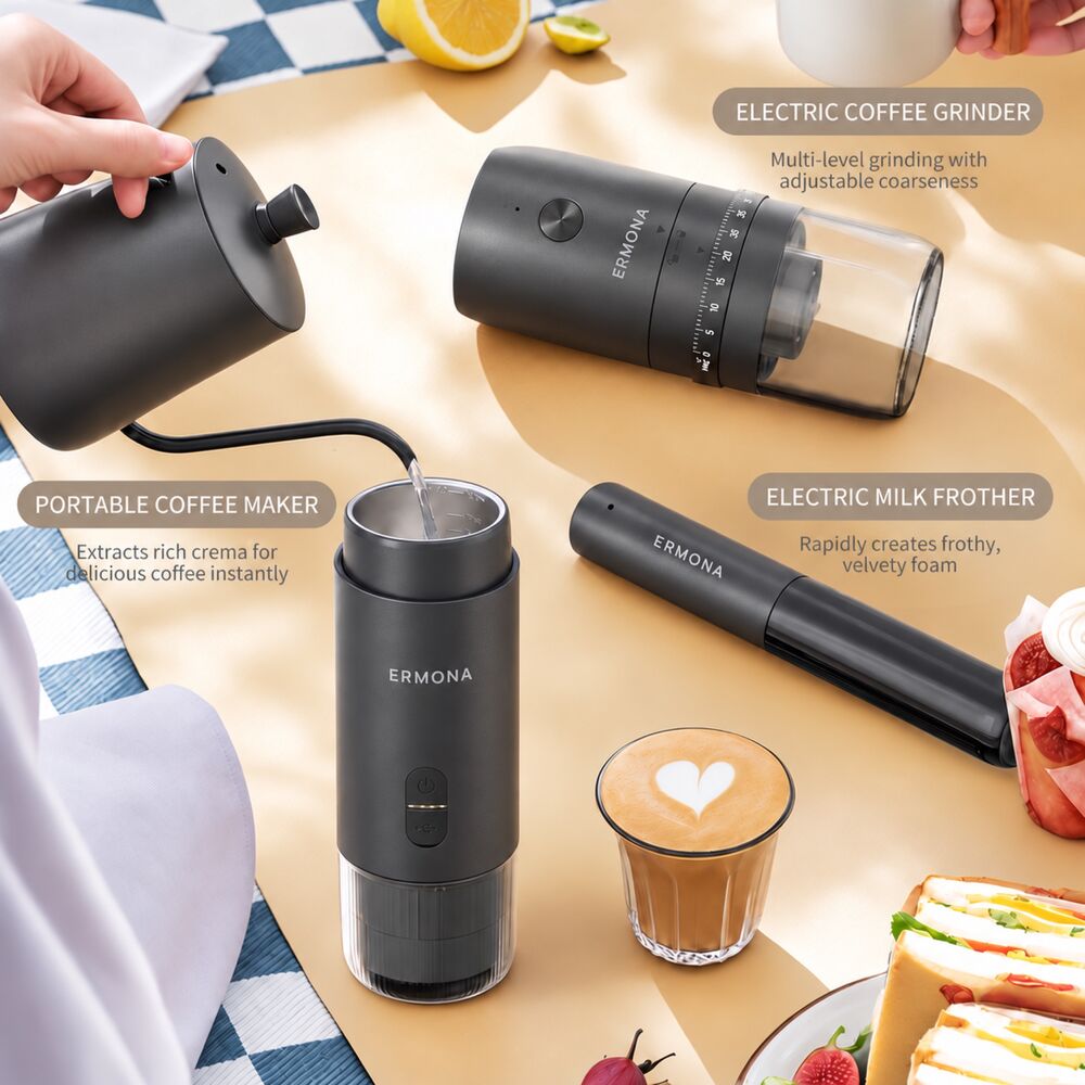 Hot water poured from a gooseneck kettle into the Ermona espresso maker on a picnic table, with the electric grinder, milk frother and a latte nearby.