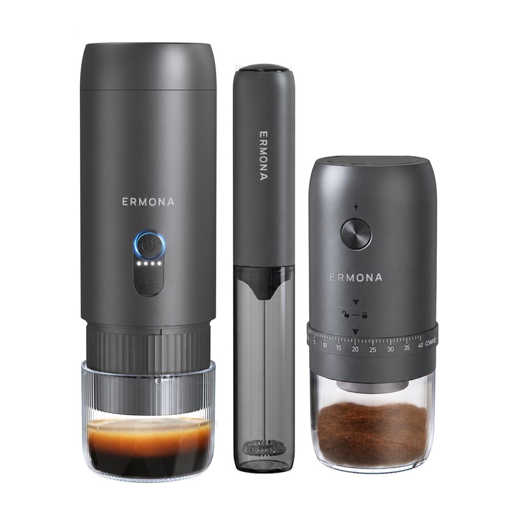 The Ermona portable espresso gift set on white: the dark grey espresso maker with a shot of espresso in its cup, the slim milk frother, and the electric grinder with fresh grounds in its glass jar.